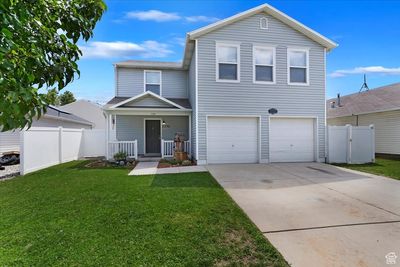 Front of property featuring a garage and a front lawn | Image 1