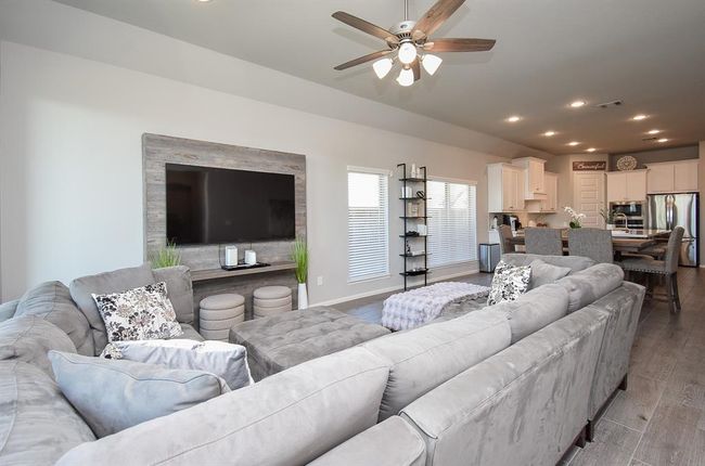 Spacious living room filled with natural light. | Image 17