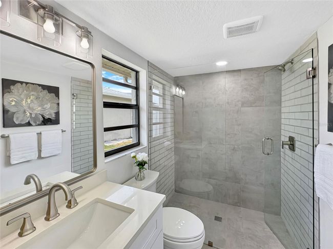 Primary Bathroom – Full View with Shower, Toilet & Sink | Image 21