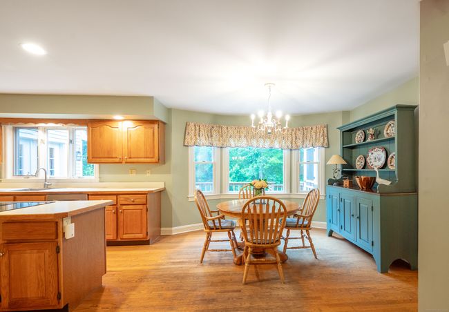Spaciouis dining area in Kitchen with beautiful back-yard views | Image 11
