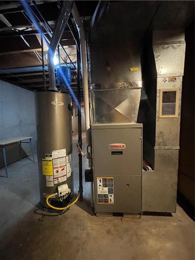 Utility room with heating unit and water heater | Image 34