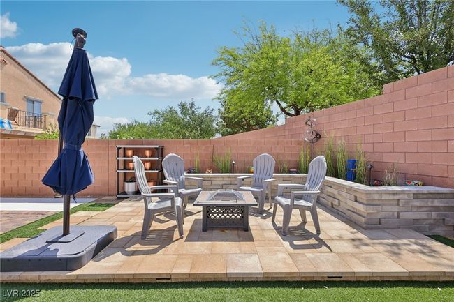 Fenced backyard featuring an outdoor fire pit and a patio | Image 61