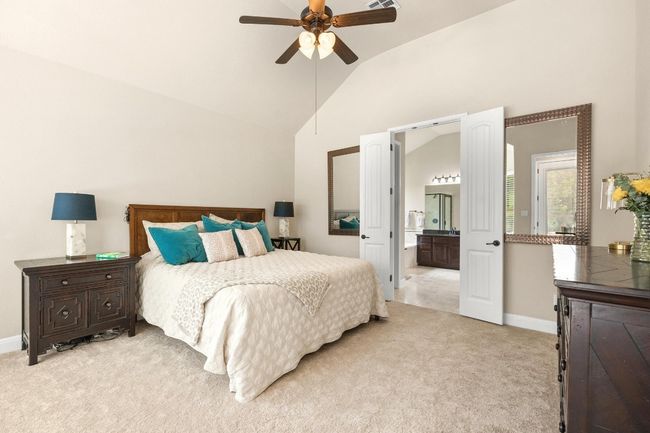 Primary bedroom on main floor with bay windows, high ceilings and french doors to bathroom | Image 16