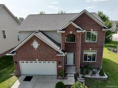 30903 Asbury Hill Drive, Home with 4 bedrooms, 3 bathrooms and null parking in Lyon Twp MI | Image 1