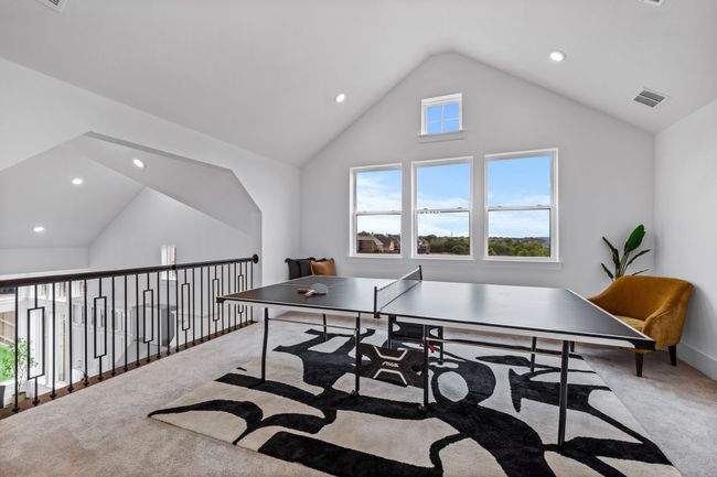 Rec room with lofted ceiling and carpet | Image 24