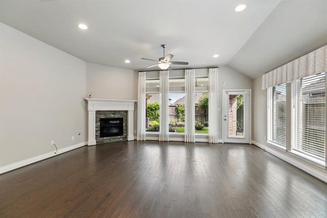 Spacious Living area with Window Treatments as well as Blinds. | Image 11