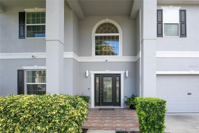 The beautiful entry to the home has a stunning leaded etched glass door with side lites, a paver porch and it's move-in ready. Let's go take a look... | Image 3