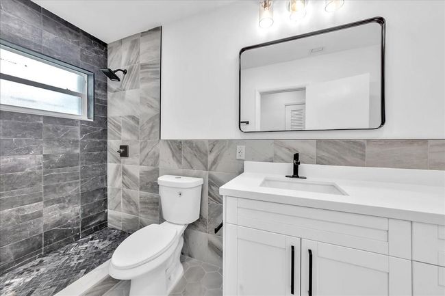 New Vanity, Toilet, Fixtures & Newly Tiled Shower | Image 27