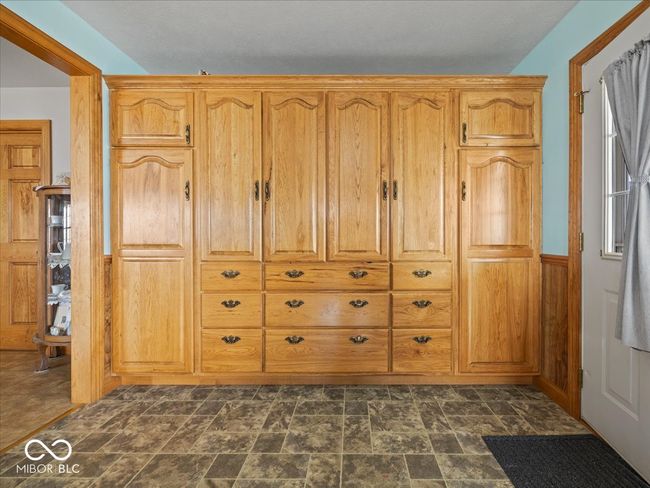 Full wall of storage in these oak cabinets. | Image 5