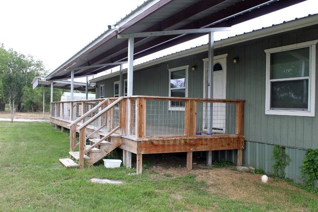 Wooden terrace featuring a yard | Image 4
