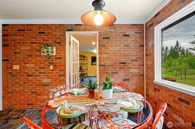The breakfast area is just off the oversized walk in pantry and provides access to the back stairway. | Image 11