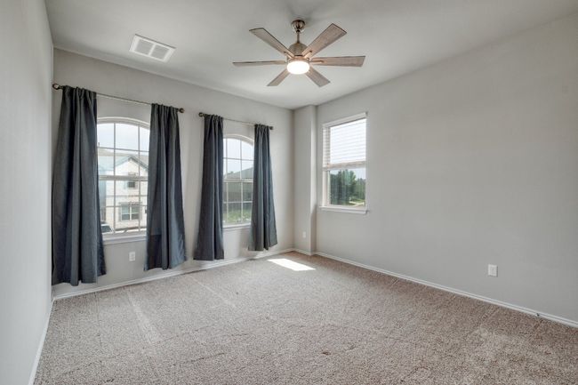 Empty room featuring carpet and ceiling fan | Image 22