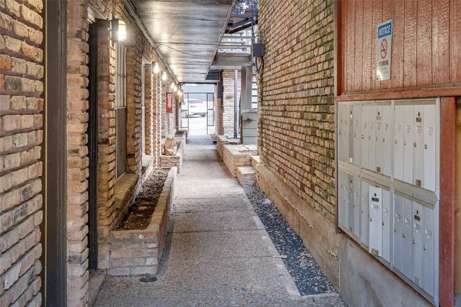 Hall with mail area and brick wall | Image 24