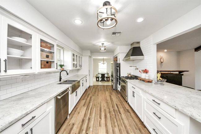 Updated and elegant, this kitchen is a chef’s dream with top-tier features and thoughtful design. | Image 10