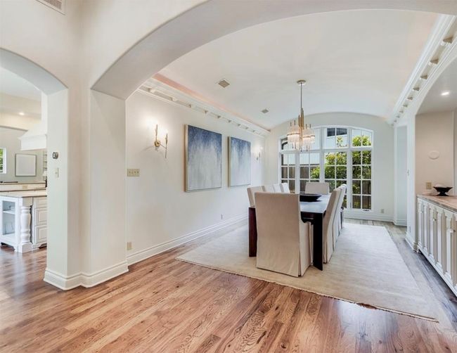 Dining space offers a beautiful setting for entertaining guests. | Image 8