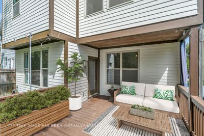 Backyard lovers--here's your chance! Your oversized partially covered deck--recently repainted--has a great view of mature trees lining the back of the yard with plenty of space to watch kids/pets play. | Image 1