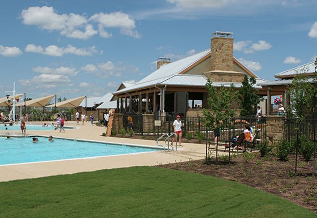 Community pool with a patio area, fence, and a lawn | Image 30