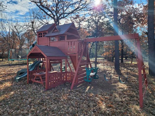 View of playground featuring a trampoline | Image 24