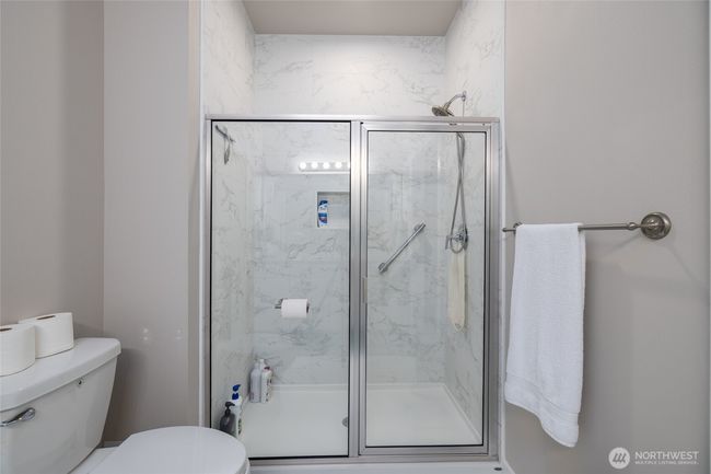 Here's a view of the tile shower in the primary bath. | Image 26