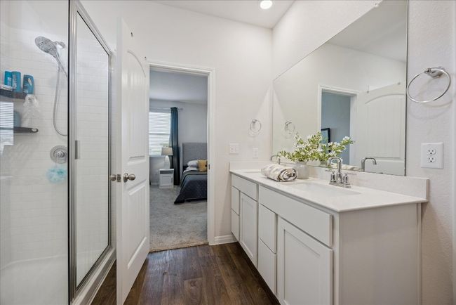 Ensuite bathroom with wood finished floors, a stall shower, and​​‌​​​​‌​​‌‌​‌‌​​​‌‌​​‌‌​‌​​​​​‌ vanity | Image 29