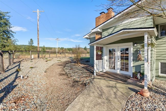 The covered front porch offers a warm and inviting welcome, creating the perfect spot to greet guests. Complementing this charming entry is the newly landscaped front yard, which adds a fresh touch to the home’s curb appeal | Image 6