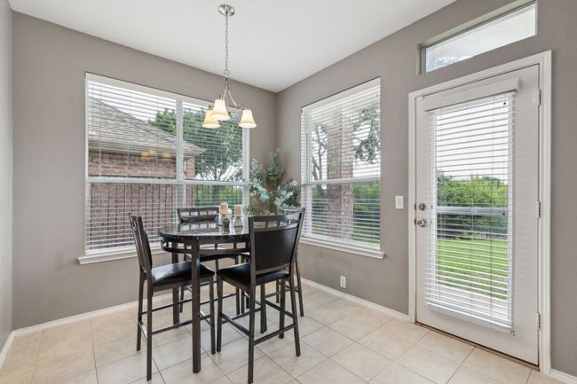 Dining space featuring baseboards, a chandelier, and light tile patterned​​‌​​​​‌​​‌‌​‌‌​​​‌‌​​‌‌​‌​​​​​‌ floors | Image 16