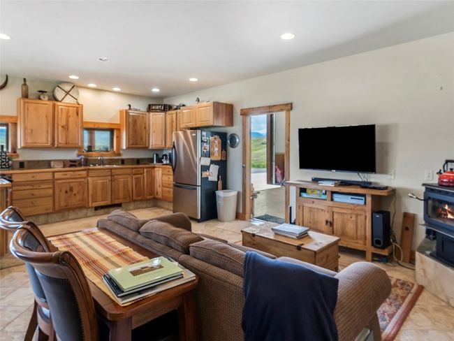 Living room with sink and light tile patterned flooring | Image 20