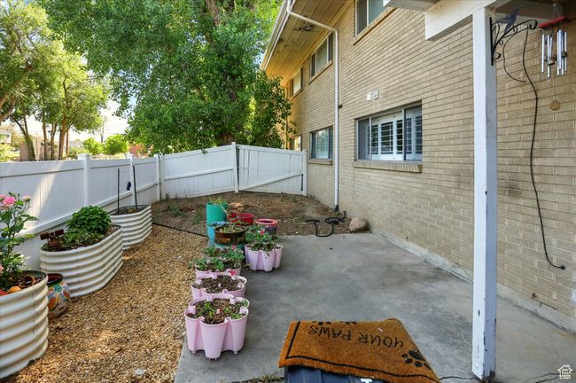 Fenced backyard featuring a patio | Image 24