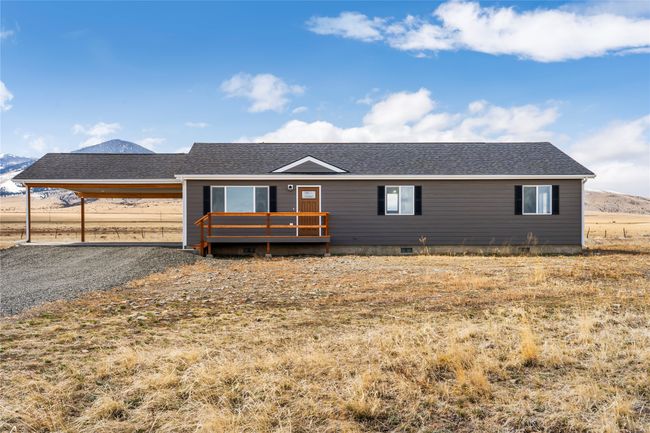 Ranch-style home featuring a deck with mountain view, crawl space, and roof with shingles | Image 18