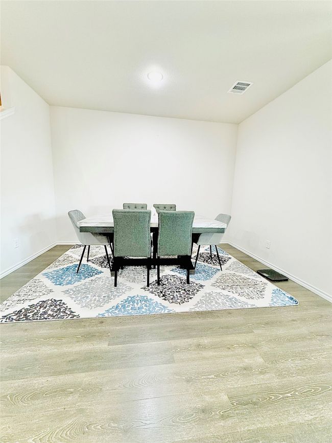 Dining area featuring baseboards, wood finished floors, and recessed lighting | Image 13