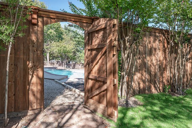 Gate leading to back yard. | Image 30