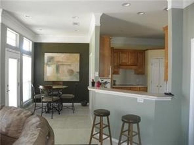 Breakfast area plus eat up bar area Open Concept kitchen to Living family room | Image 6