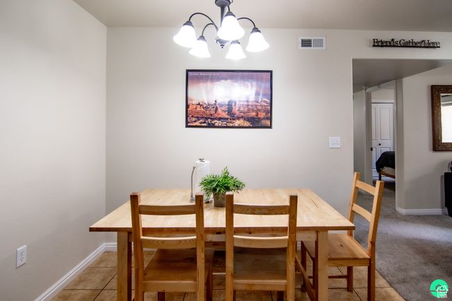 Dining space featuring a chandelier | Image 9