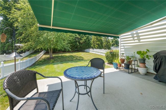 Fenced backyard with a patio and a grill | Image 40