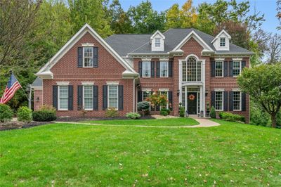 Fabulous custom home with new updates and gorgeous level lot with timeless curb appeal! This home is the ultimate in fine living in the premium community of "Treesdale!" | Image 1