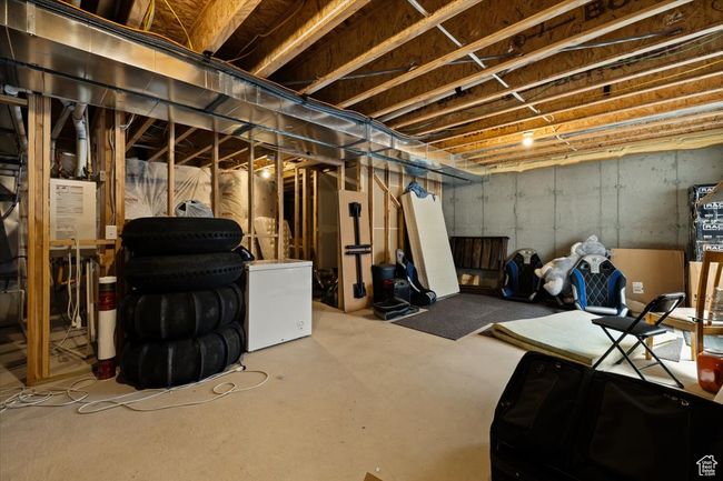 Unfinished below grade area featuring refrigerator | Image 28
