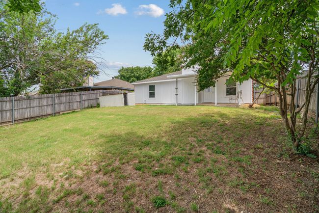View of fenced backyard | Image 35