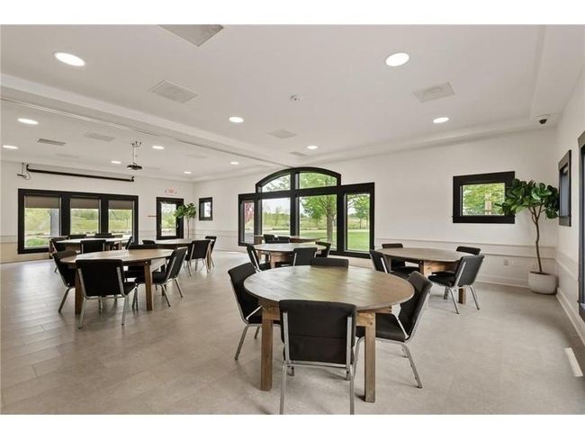 Your assoc fees include full access to the walkable and beautiful Waters Edge Community Center! pool, gym, and party room with kitchen! | Image 27