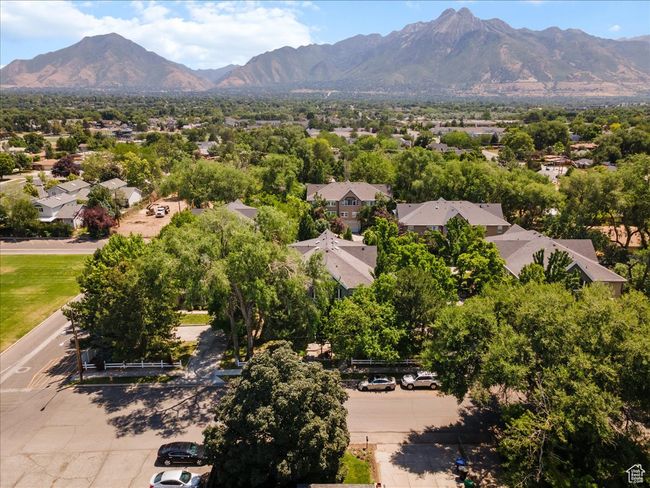 Aerial perspective of suburban area featuring a mountain backdrop | Image 34