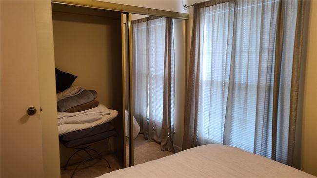 Downstairs bedroom closet. | Image 9