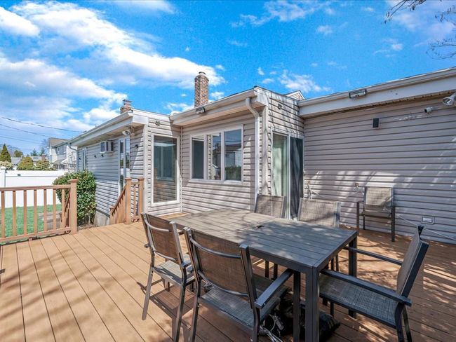 Wooden terrace featuring outdoor dining area and fence | Image 23