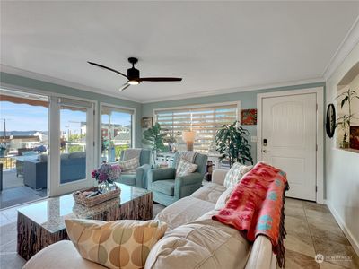 Open living area with exterior slider to the large patio/deck. | Image 2