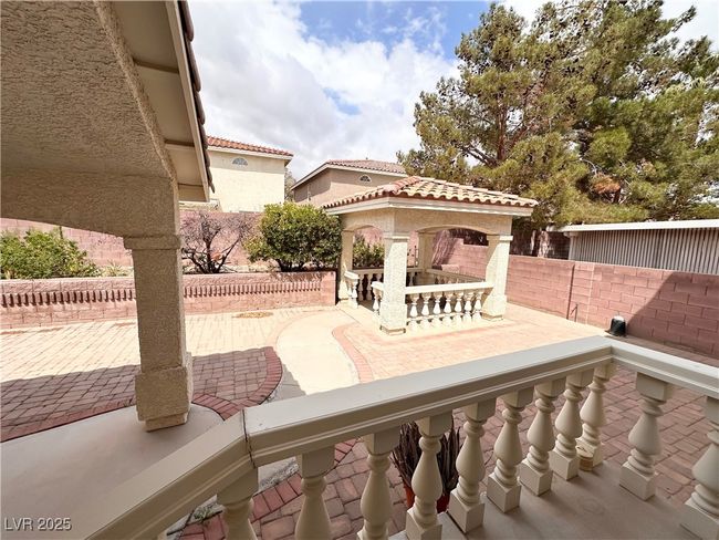 View of patio featuring a fenced backyard and a gazebo | Image 28