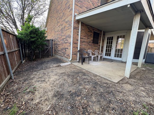View of patio / terrace with central AC unit, fence, and french doors | Image 20