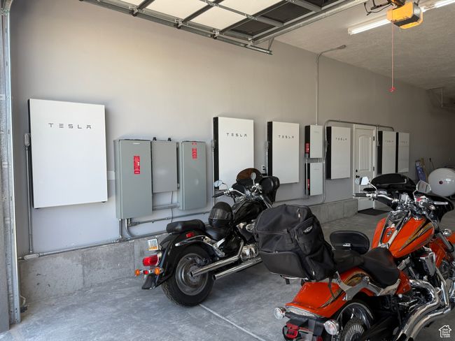 Garage featuring a garage door opener | Image 100