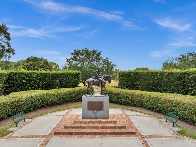 Statue at main entrance. Walking/Biking Trail starts behind the status which leads to Tree Tops! | Image 42