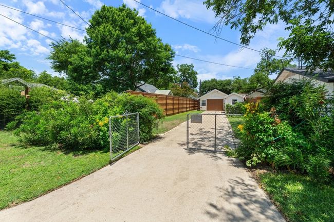 view of back driveway from back street to detached garage | Image 33