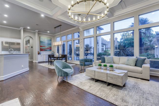 Another view of the open main living area of the home. The home offers lots of arched entries, and 8-ft solid-core doors. | Image 11