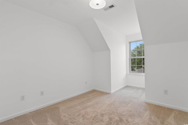 Bonus room with carpet, vaulted ceiling, baseboards, and ceiling fan | Image 24