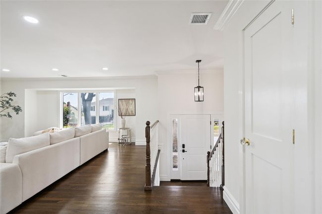 Entryway featuring ornamental molding, dark wood finished floors, and recessed lighting | Image 10